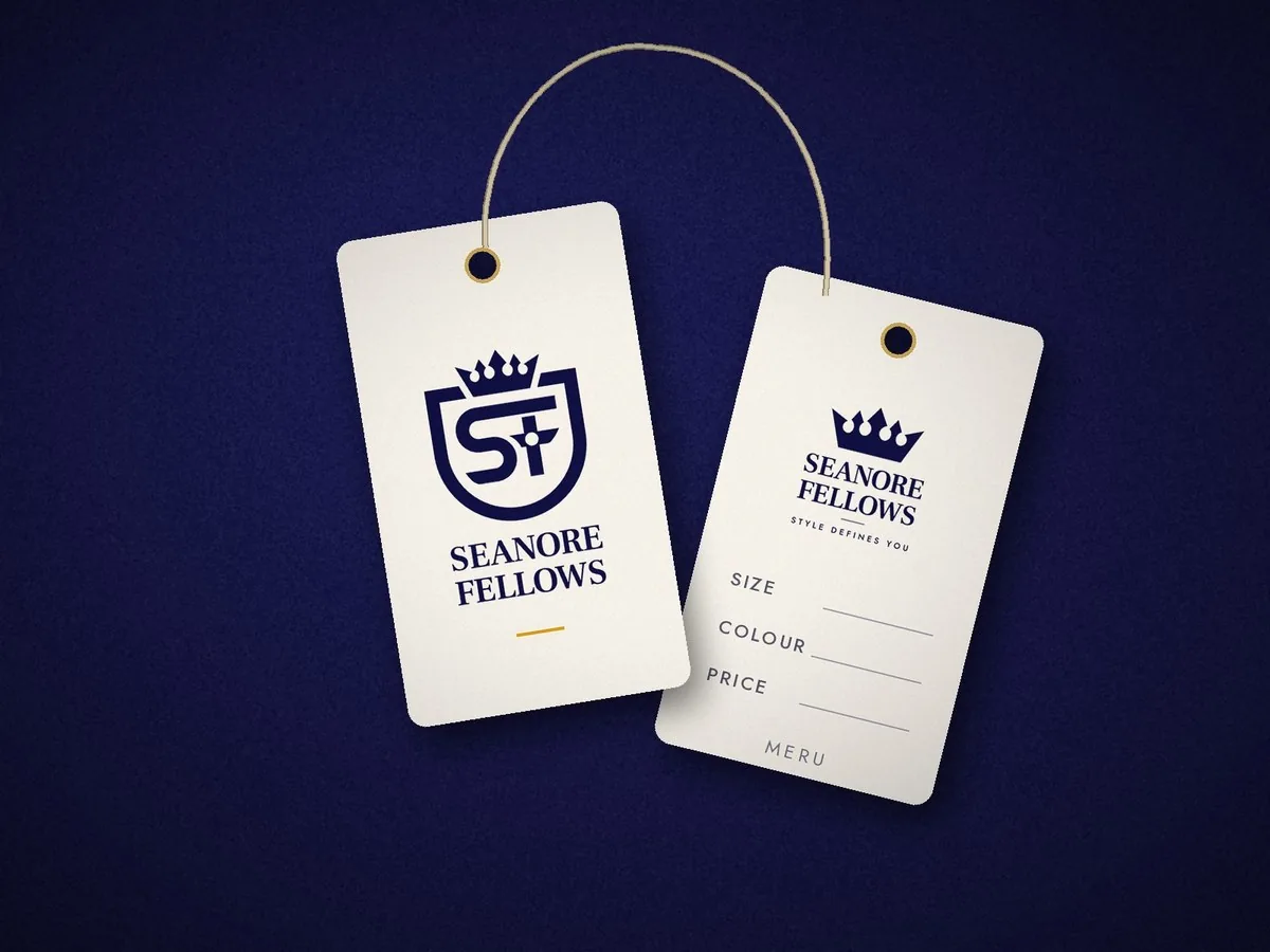 Ivory hang tags with the navy crest on the front and size, colour and price fields on the back