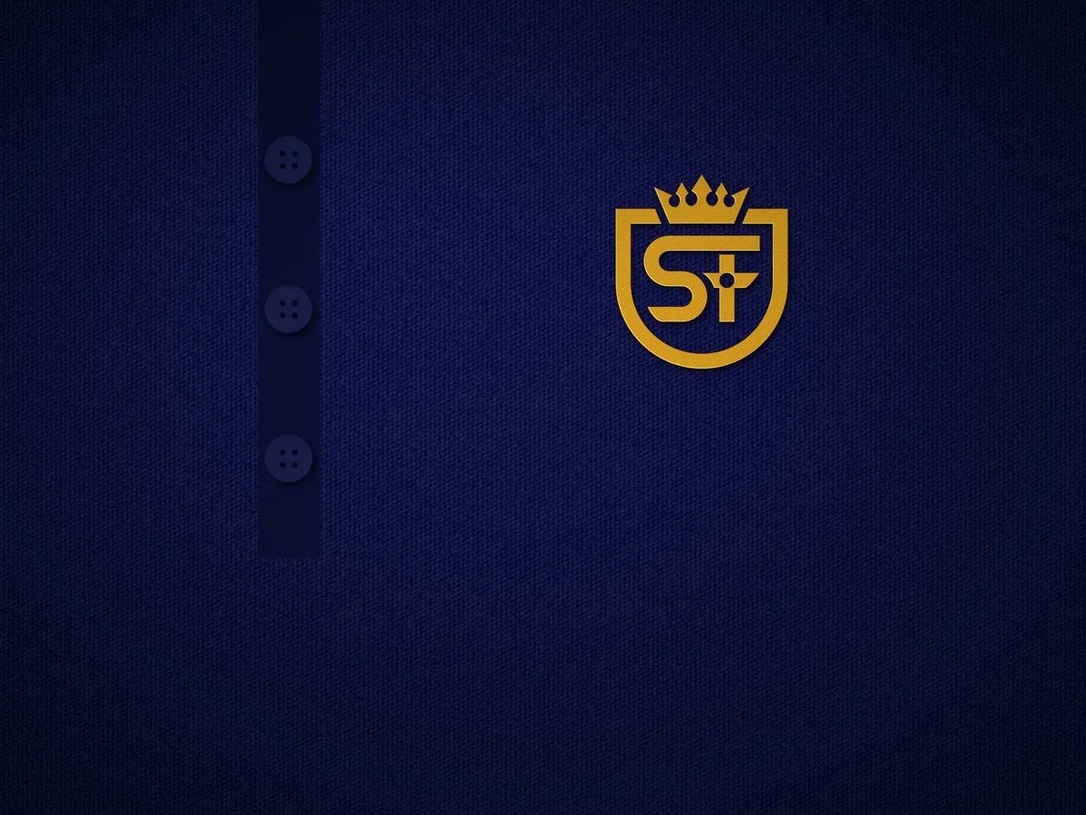 Navy pique polo with the gold crest embroidered on the left chest
